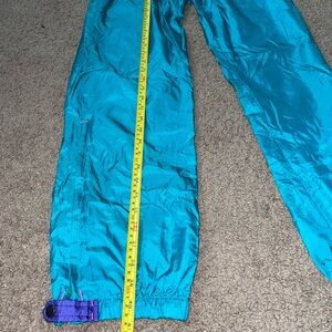 Men’s Medium vintage Columbia turquoise and purple nylon windbreaker pants, zips
